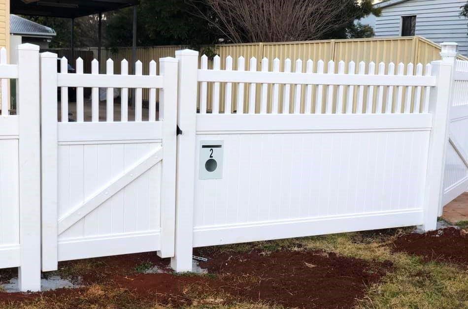 Eleanor picket-top privacy fence gallery with pedestrian gate and letterbox panel by Queensland Fencing Specialists