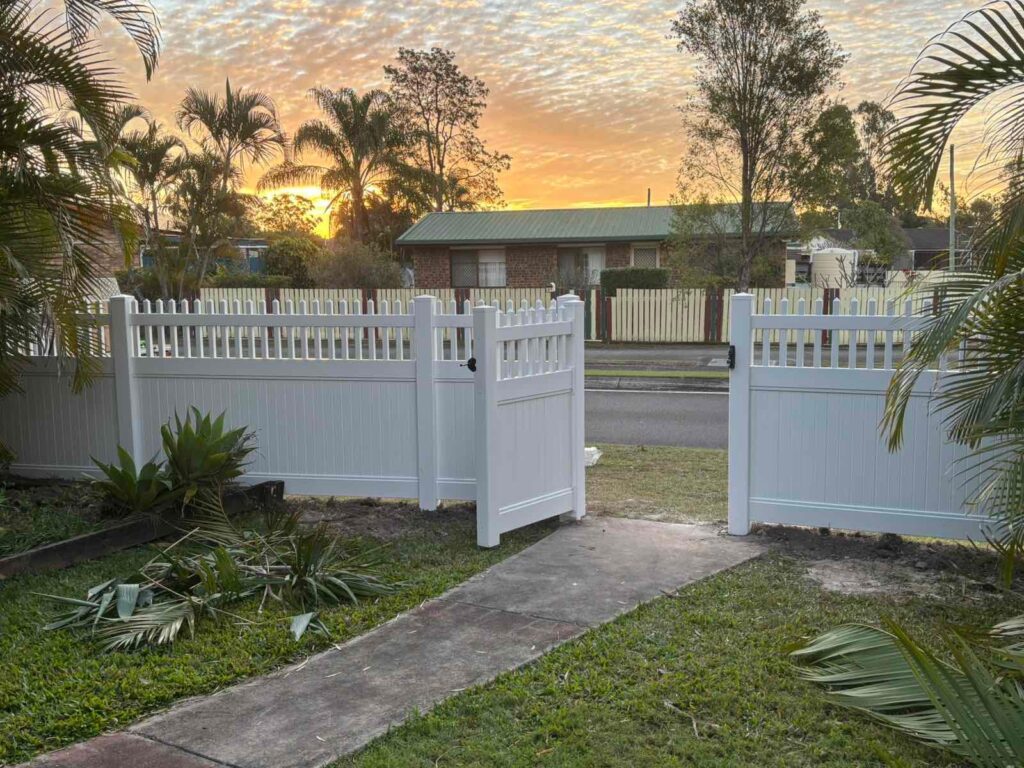 Eleanor picket-top privacy fence gallery front gate entrance at sunset by Queensland Fencing Specialists