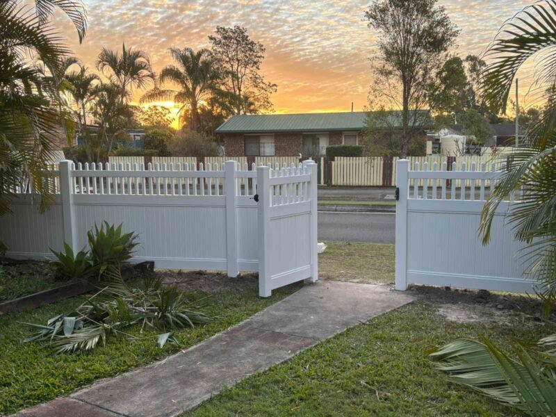 Eleanor picket-top privacy fence gallery front gate entrance at sunset by Queensland Fencing Specialists
