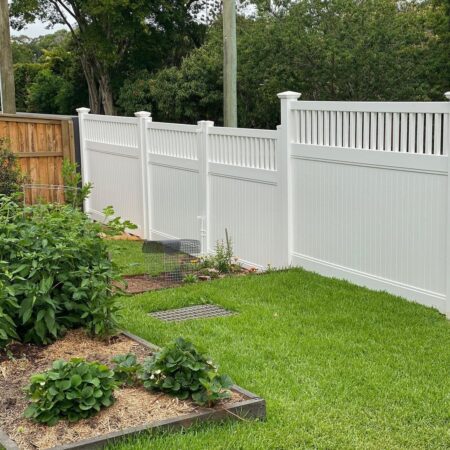 Mary PVC fence gallery backyard installation with garden edging by Queensland Fencing Specialists